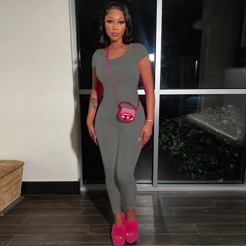 Bold and Stylish Backless Solid Pink Jumpsuit with Short Sleeves and Slim Fit Design