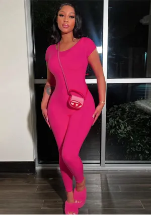 Bold and Stylish Backless Solid Pink Jumpsuit with Short Sleeves and Slim Fit Design