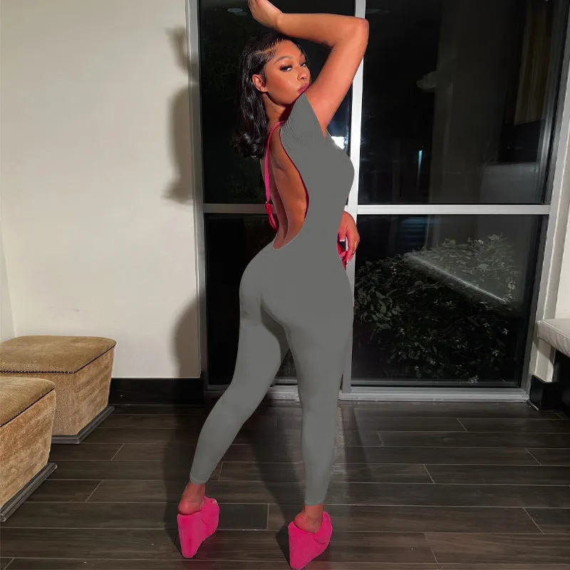 Bold and Stylish Backless Solid Pink Jumpsuit with Short Sleeves and Slim Fit Design