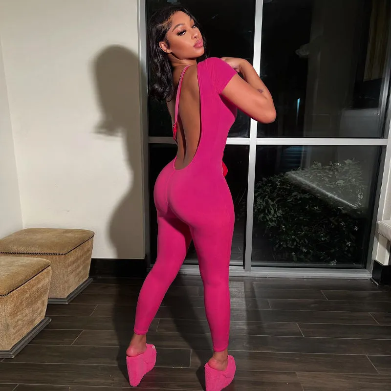 Bold and Stylish Backless Solid Pink Jumpsuit with Short Sleeves and Slim Fit Design