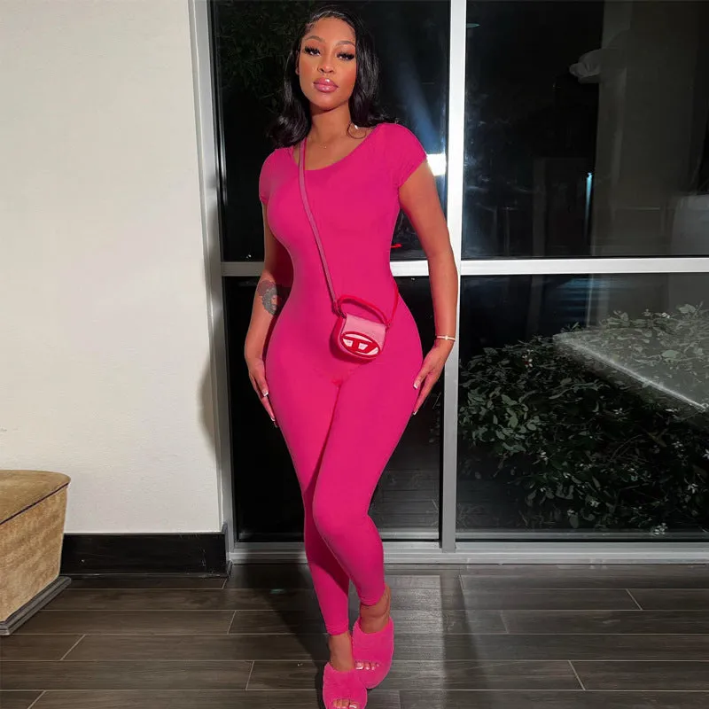 Bold and Stylish Backless Solid Pink Jumpsuit with Short Sleeves and Slim Fit Design